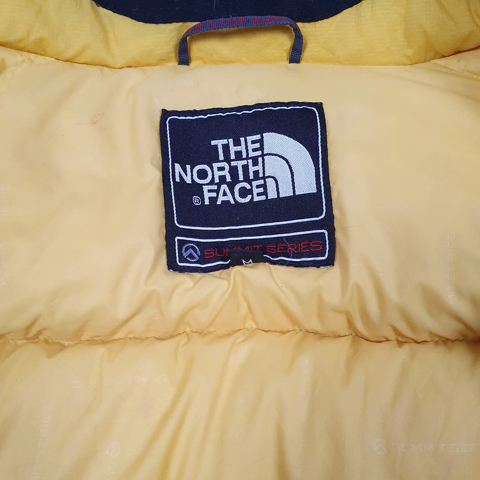 Mens Yellow The North Face Summit Series Baltoro 800  Coat