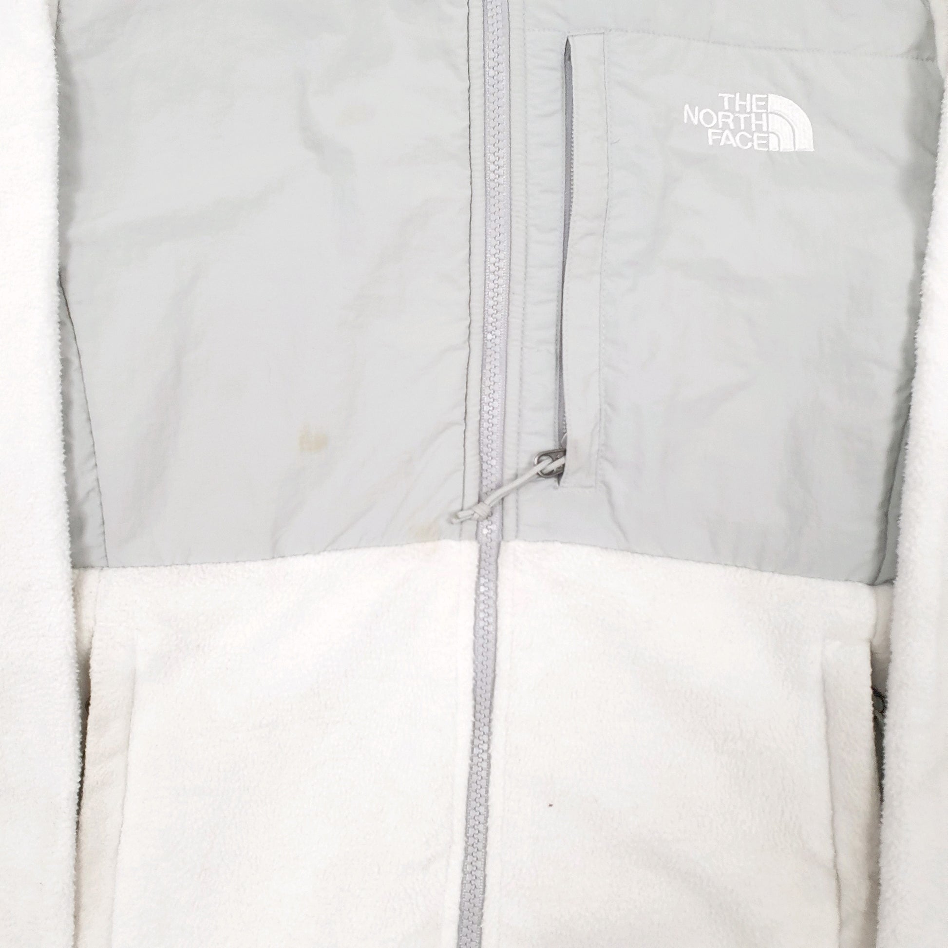 Womens White The North Face Stains on the centre front and discolouration on both Sleeves. Full Zip Jumper