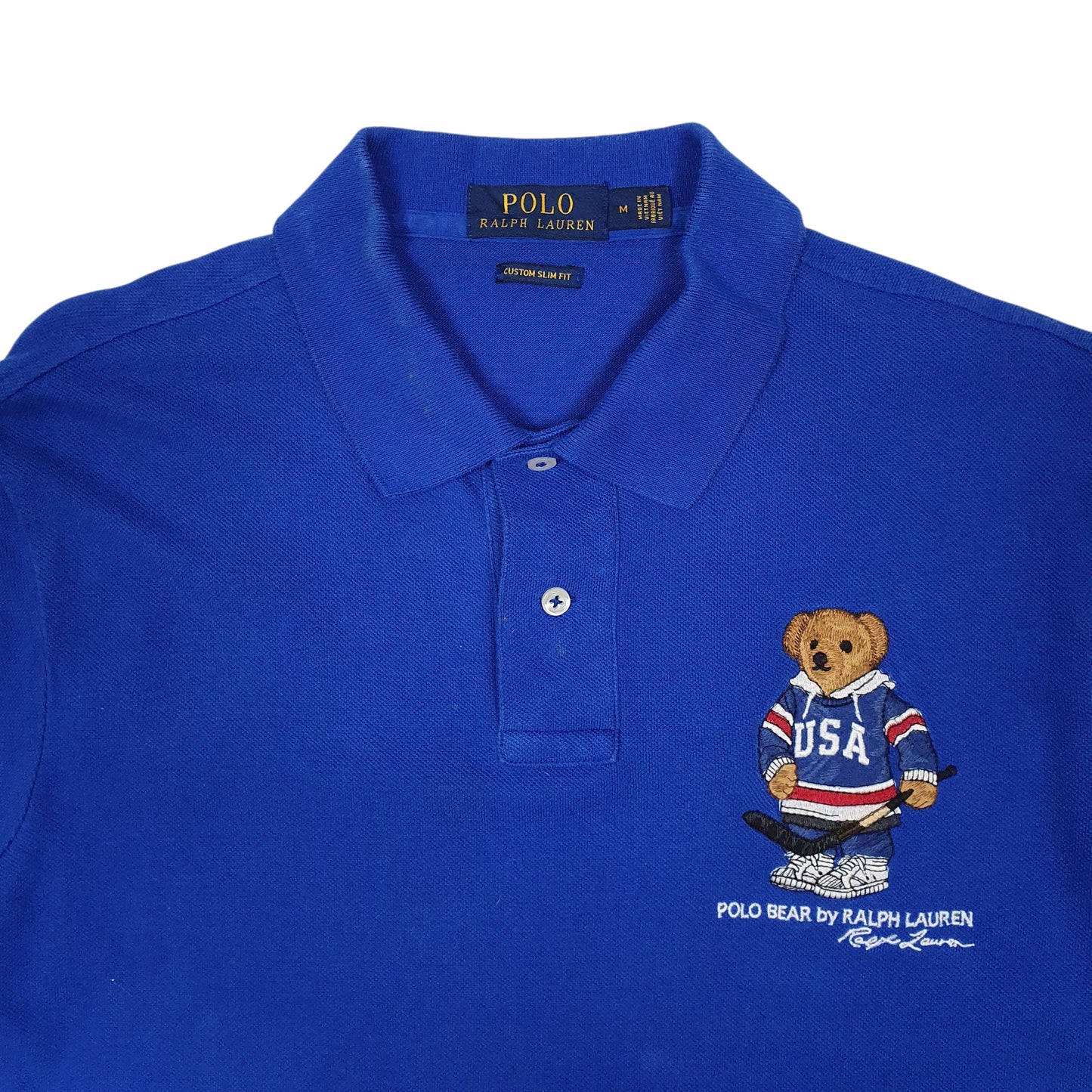 Mens Blue Polo Ralph Lauren Several small faint stains around collar and buttons. Fading to sides of collar. Small black marks on back of left sleeve.  Polo Shirt