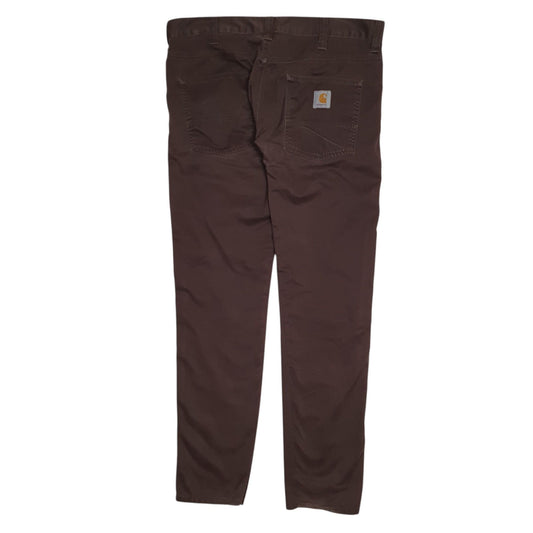 Mens Brown Carhartt Trousers altered to slim fit. Minor damage to back of hems. Tags very worn down, tagged W33 but measure W36.  Trousers